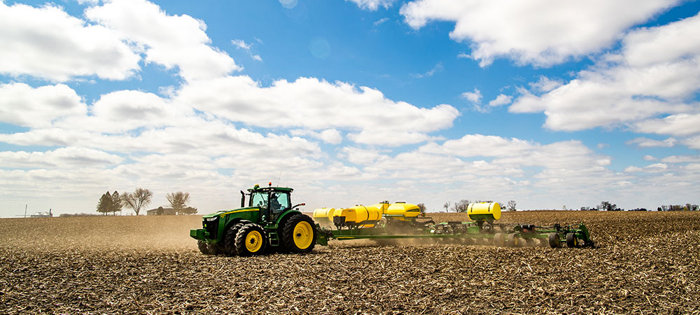 tractor in a field planting